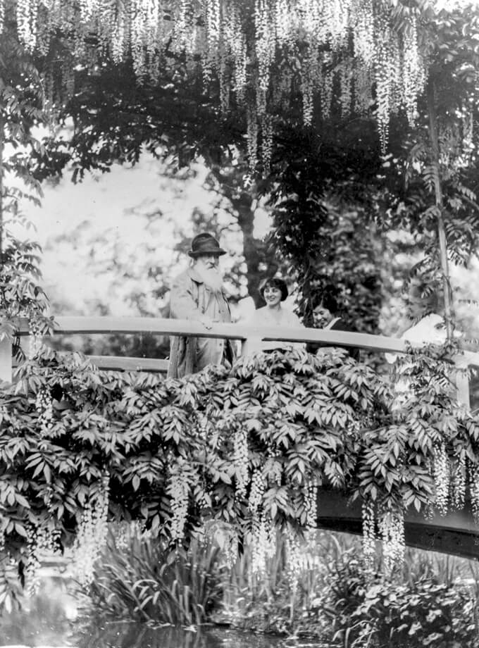 Monet on the taico bridge with two kimono women in Giverny.